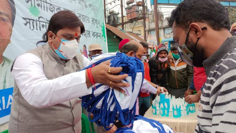 Priyangu Pandey made transport workers and passengers aware by giving mask-sanitizer in a covid 19 awareness program organized in North 24 Parganas